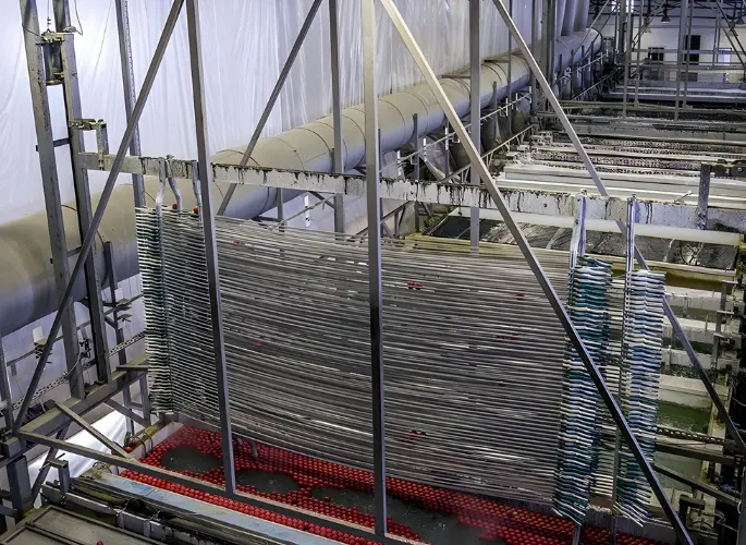 Metal rods are dipped into an anodizing solution.