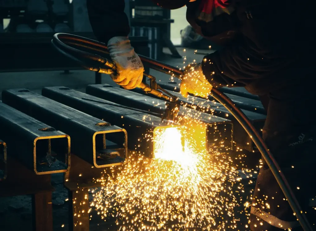 A welder joins metal extrusions.