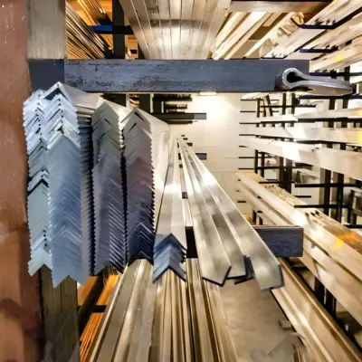 Several equal angle extrusions rest on a shelf.