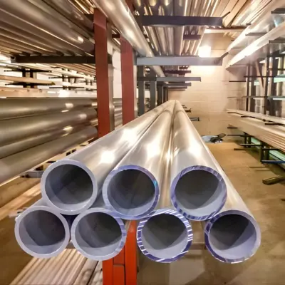 Several pipe extrusions rest on a shelf.
