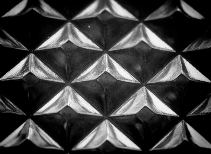 An embossed sheet of aluminum with a quilted pattern