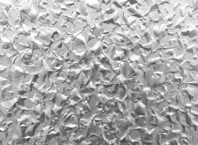 An embossed sheet of aluminum with a stucco pattern